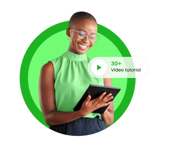 An image of a lady looking at her phone while smiling.